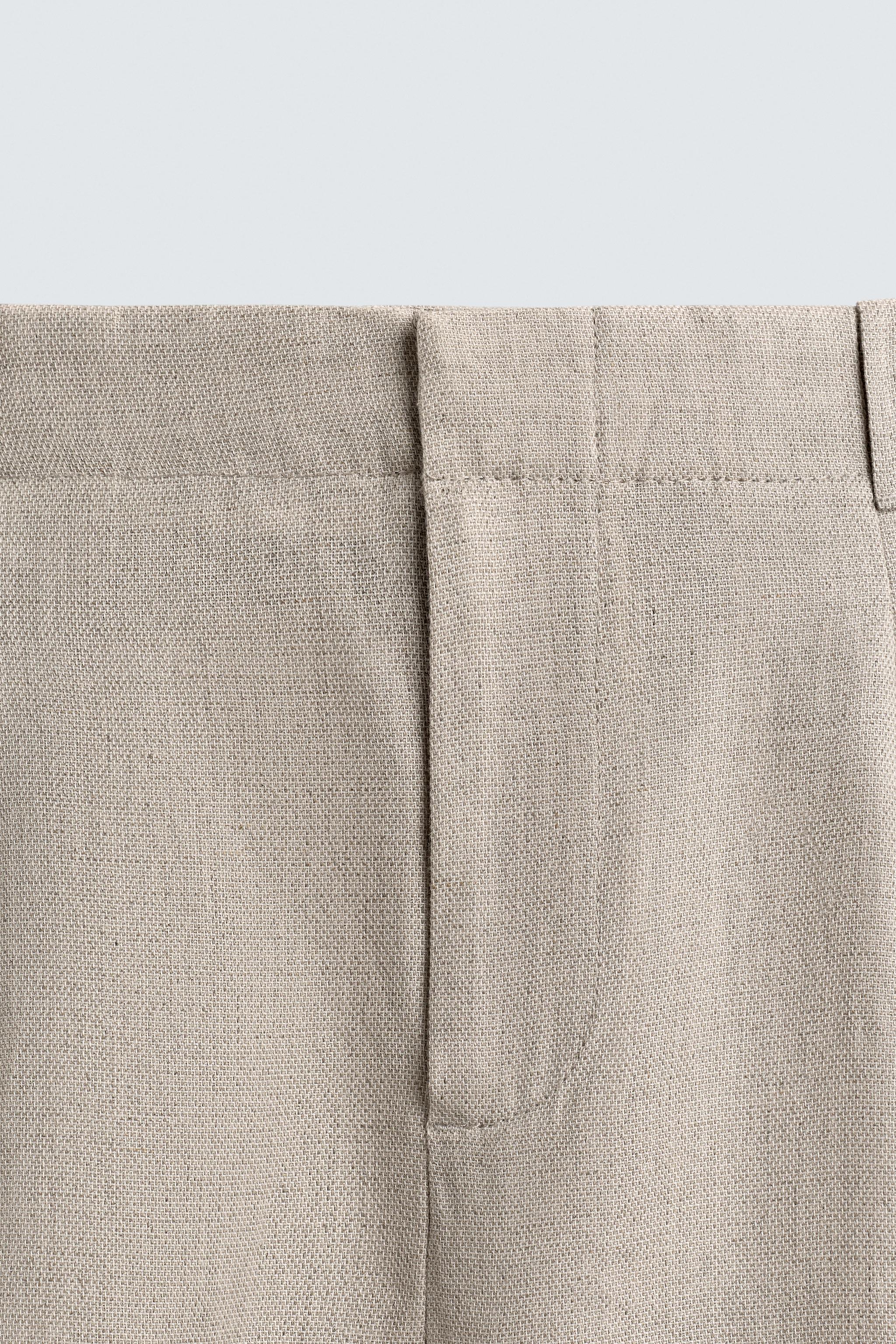 PANTALON À PLIS EN COTON ET LIN